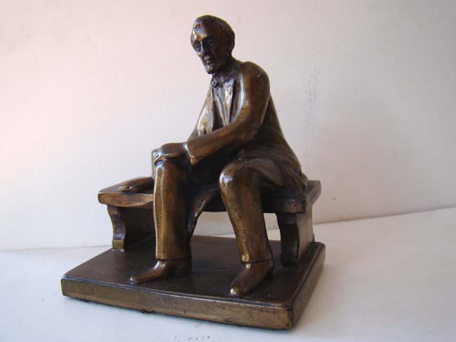 A nice small pair of bronze bookends circa 1935 depicting Abraham Lincoln sitting on a bench — image 2